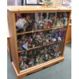 A modern pine glass fronted bookcase