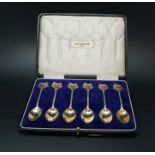 Sydney & Co. A cased set of six silver gilt & enamel commemorative tea spoons