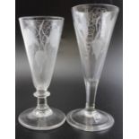 Two 18th century ale flutes with engraved barley and hop decoration, the taller one with a folded fo
