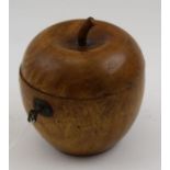 A Georgian design fruitwood apple for tea caddy, the hinged cover reveals silvered interior