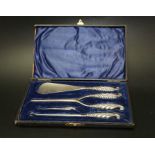 William Devenport, a Victorian silver handled set of four cased dressing items, includes button hook