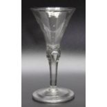 An 18th century bubble stem glass, folded foot circa 1740