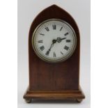 An Edwardian mahogany lancet cased mantel timepiece, with white enamel dial having Roman numerals, 8