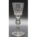 An 18th century Continental wine glass, engraved with Stag folded foot circa 1740