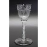 An 18th century engraved opaque twist glass circa 1770