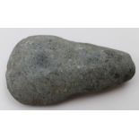 A pre-contact Papa New Guinea carved stone axe head