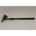 Payne & Son, a silver candle snuffer, with cast flame decoration, fitted on an ebony handle, London