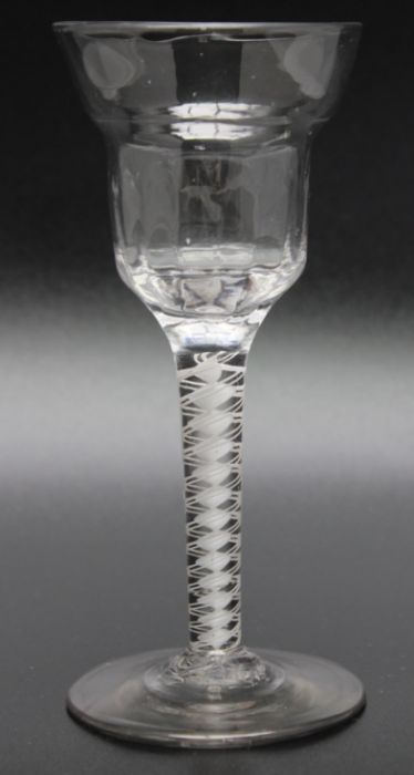 An 18th century opaque twist half moulded double ogee bowl glass, circa 1765