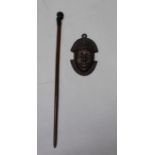 A carved African stick with human head pommel, 70cm together with a cast bronze Benin style wall mas