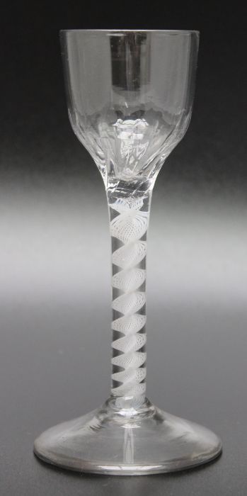 An 18th century opaque twist half moulded ogee bowl glass, circa 1765
