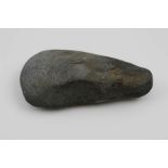 A pre-contact Papa New Guinea carved stone axe head