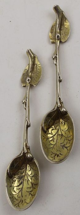 Sebastian Crepel II, A pair of early Victorian cast silver gilt leaf teaspoons, London 1842, 42g