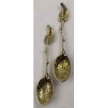 Sebastian Crepel II, A pair of early Victorian cast silver gilt leaf teaspoons, London 1842, 42g