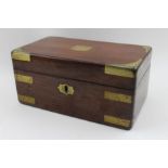 A 19th century mahogany box with brass bands protective corners to the hinged lid,