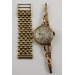 A 9ct gold ladies' wristwatch, together with a section of 9ct gold watch strap