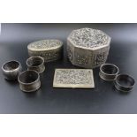 A collection of five various silver napkin rings, combined weight: 103g, together with two Eastern d