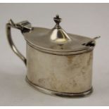 A silver mustard with blue glass liner, together with a non-matching spoon, Birmingham 1921, 79g