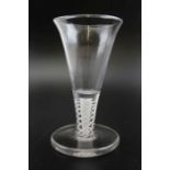 An 18th century firing glass with opaque twist stem, manufacturing blemish to the circular foot, c.1