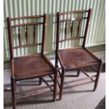 A pair of early 19th century principally Elm country stick chairs
