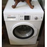 A white finished undercounter Bosch Excel 8 2X washing machine