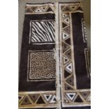An animal print rug, 140cm x 200cm, appears to be good all over