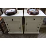 A pair of bedside cabinets