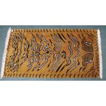 An Eastern woven woollen tiger rug, 92cm x 170cm