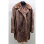 A Ladies short fur coat, hand made by Morris Delogy of Sunderland, approx size 14