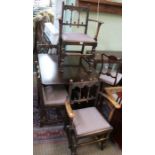 A drop leaf table together with four Ercol chairs