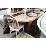 A pine oval topped kitchen table