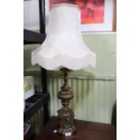 A bronze & marble effect Classical table light with tassel shade