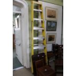 A fibreglass folding single ladder