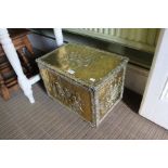 A brass embossed coal box