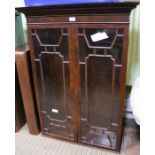 A modern mahogany fancy bar glazed bookcase unit