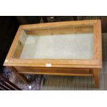 An oak glazed top coffee table/bijouterie table