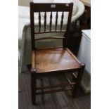 A 19th century single spindle back chair