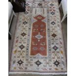 A geometric patterned woven woollen floor rug