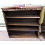 A small oak finished bookcase