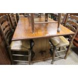 A reproduction oak finished rectangular topped refectory style table