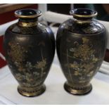 A pair of early 20th century Japanese pottery vases, signed to underside of base