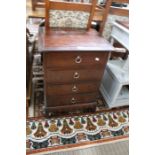 A mahogany coloured Stag four drawer chest