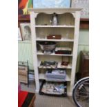 A tall painted bookcase