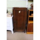 A oak upright cupboard