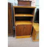 A wooden cabinet with two shelves & two doors