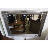 A silvered frame bevel plate wall mirror