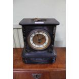 A late 19th century slate and marble French mantel timepiece