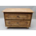 A Continental two drawer chest with caved decoration 102 x 73 cm 51m deep