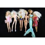 A collection of six Barbie type dolls, includes Hasbro 1993