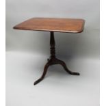 A George III mahogany tilt top occasional table, rectangular top on stem and triform supports, 76cm