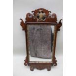 A George II design mahogany fret frame wall mirror, with gilded Ho-ho bird to crest, the plate 52cm